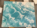 Original Dutch pour painting titled Ocean Waves by The Living Abstract, featuring vibrant blue and white abstract wave patterns.