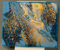 Ocean Goldrush original tilt pour painting by The Living Abstract featuring vibrant gold and blue abstract art on canvas.